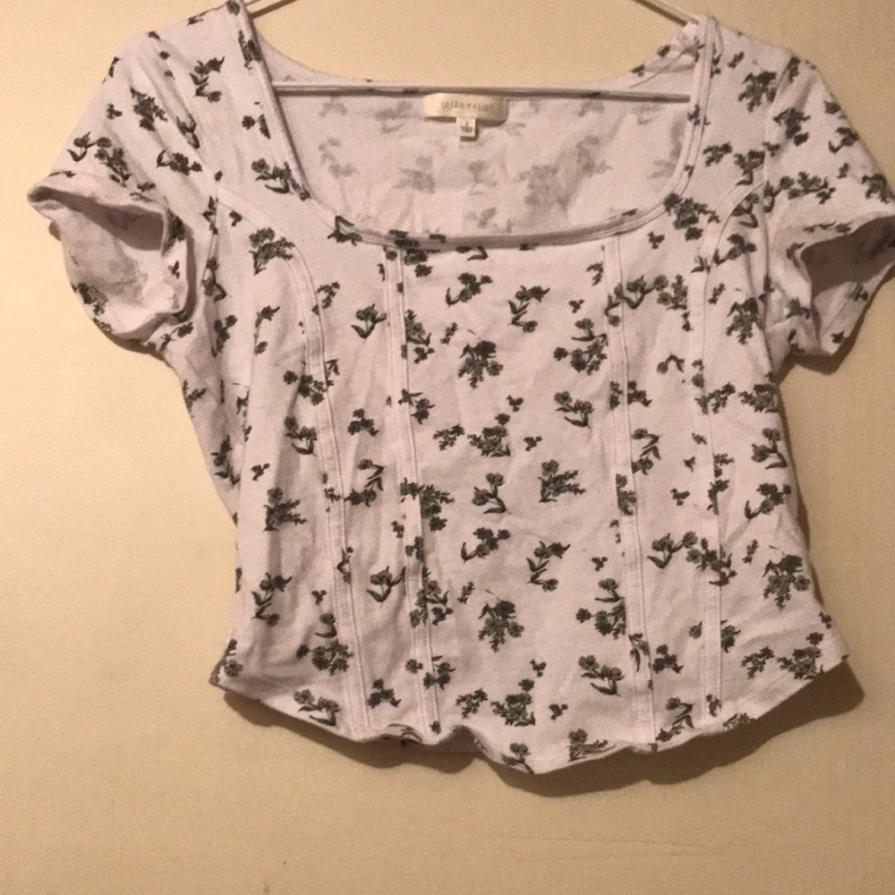 White top with green flowers.